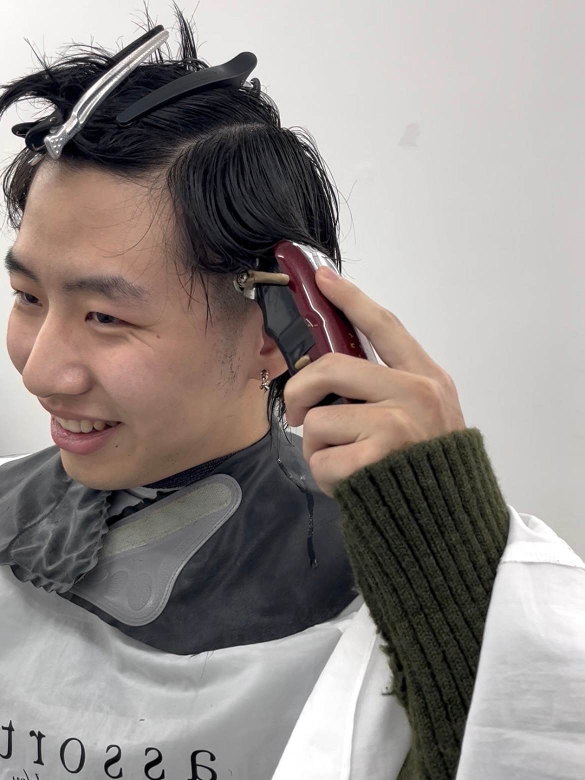Client using clippers for a side-shave transformation at Assort salon.