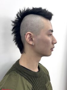 Finished Modern Mohawk hairstyle with a clean skin fade and textured vertical styling.