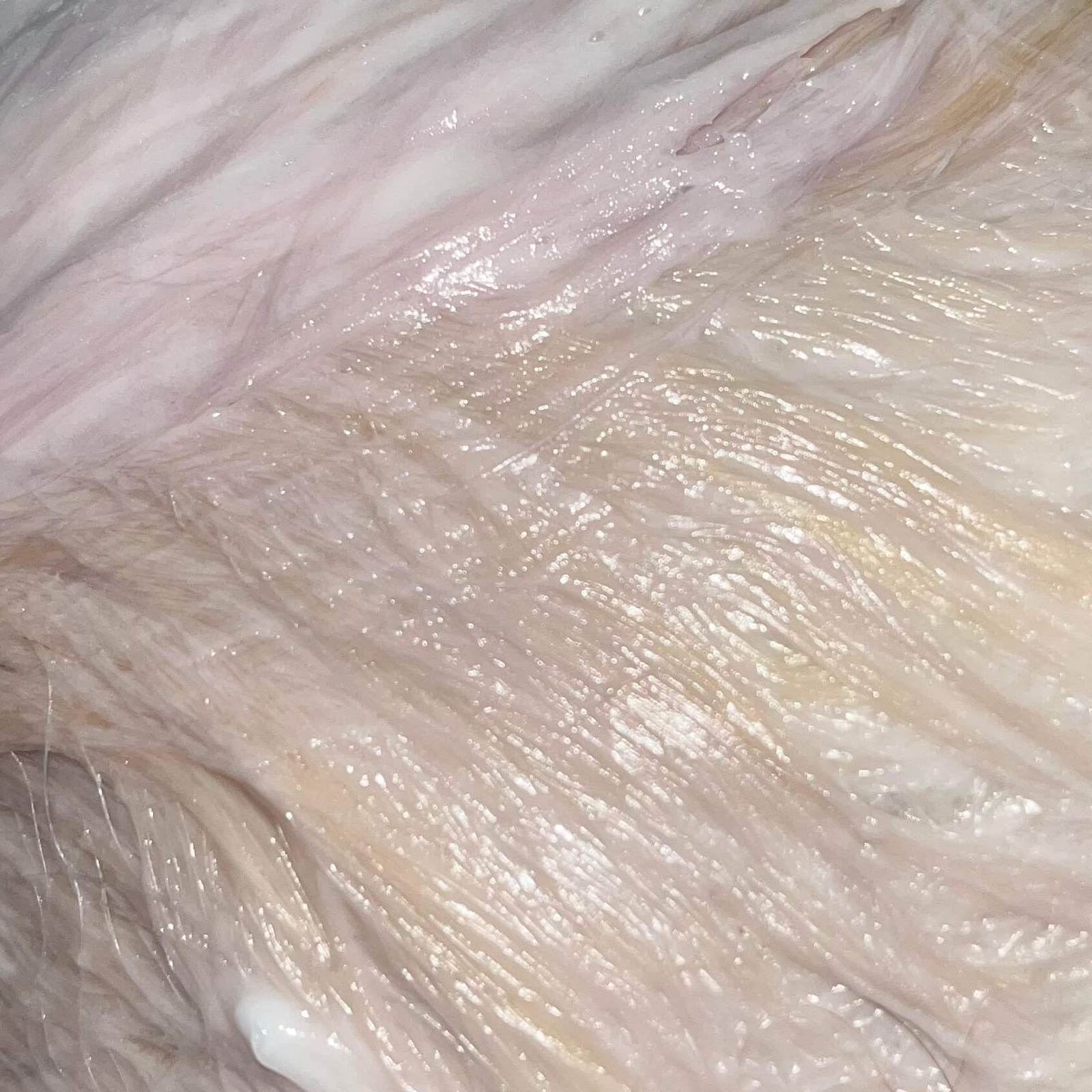 Shiny and silky hair texture with weightless layers, showcasing the result of a Milbon hair treatment at a Japanese salon.