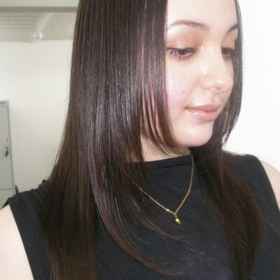 Close-up of sleek, ultra-shiny, pin-straight liquid hair styled at Assort London salon